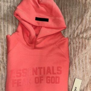 Brand new Large Coral Essential Hoodie